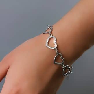 PULSEIRA ZIRCONIA COM UM CORACAO CRAVEJADO E SEIS LISO VAZADO
